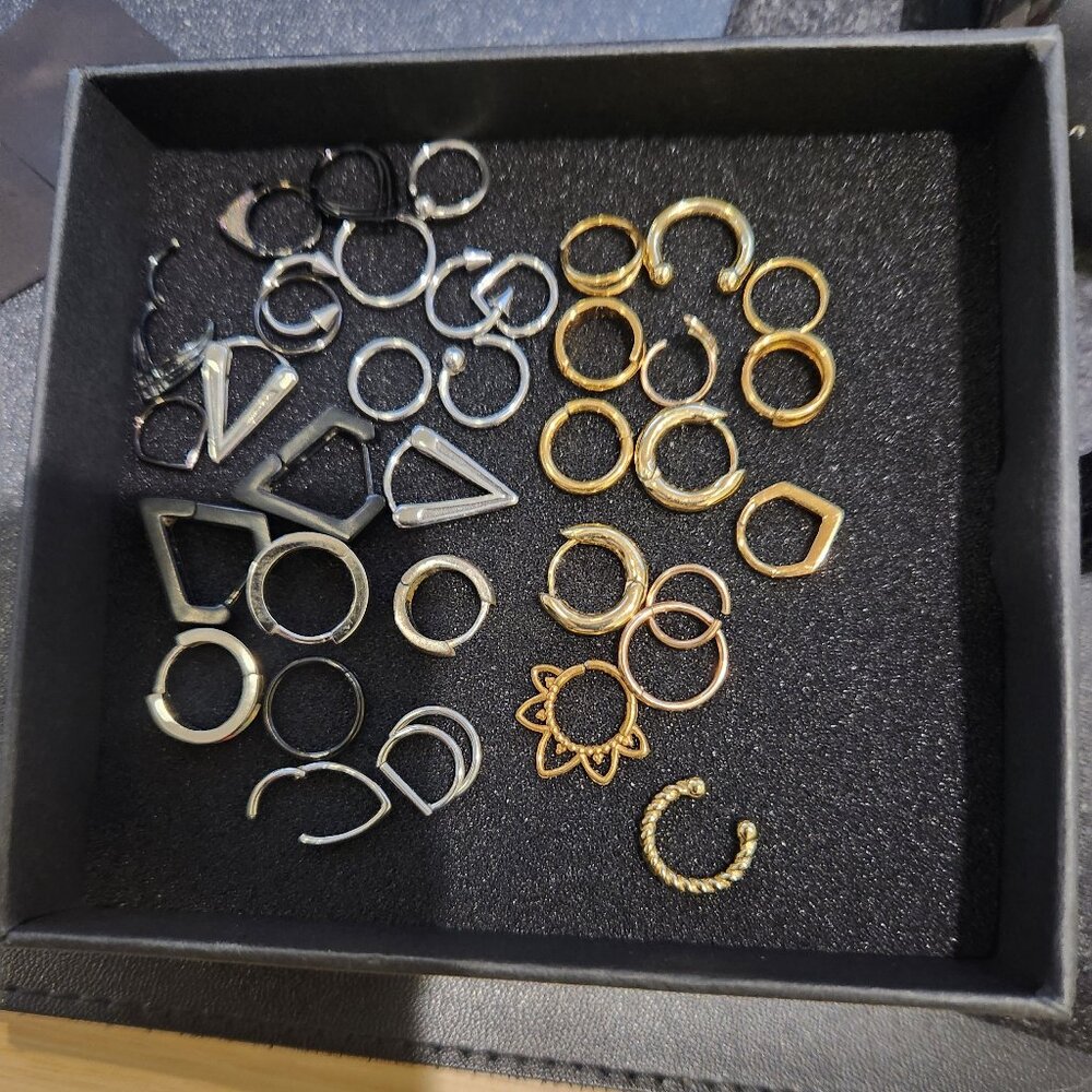 Lot of clickers and huggie earrings